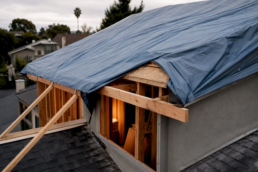 $100K–$400K Second Story Addition Cost: Ernie M.'s LA Pro Checklist second story addition cost second story addition cost 1788961499771 Tarp protecting roof during second story construction Tarp protecting roof during second story construction